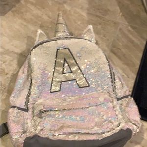 Justice “A” unicorn bag hard to find.